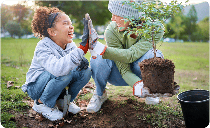 Image of woman and child planting a tree