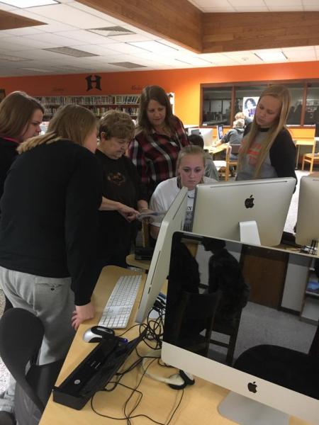 Students teach senior citizens how to use computers