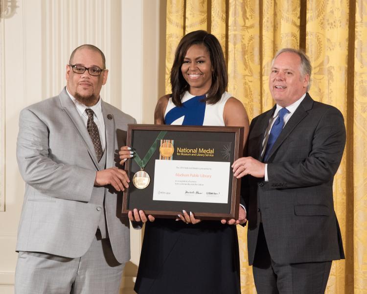 Rob Franklin and Library Director Greg Mickells accept a 2016 National Medal for Library Service awarded by First Lady Michelle Obama at The White House