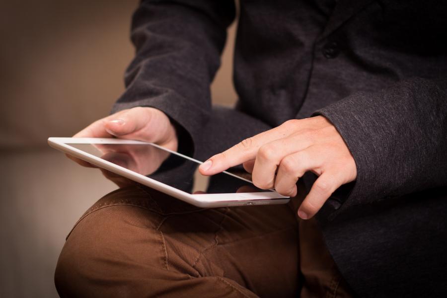 Man reading tablet