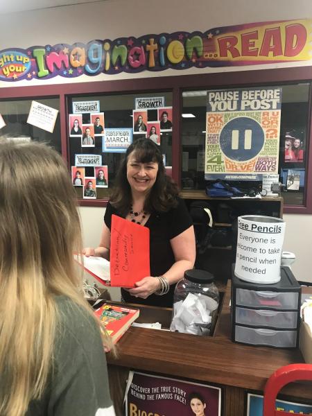 Ellen Reinerston working with a student