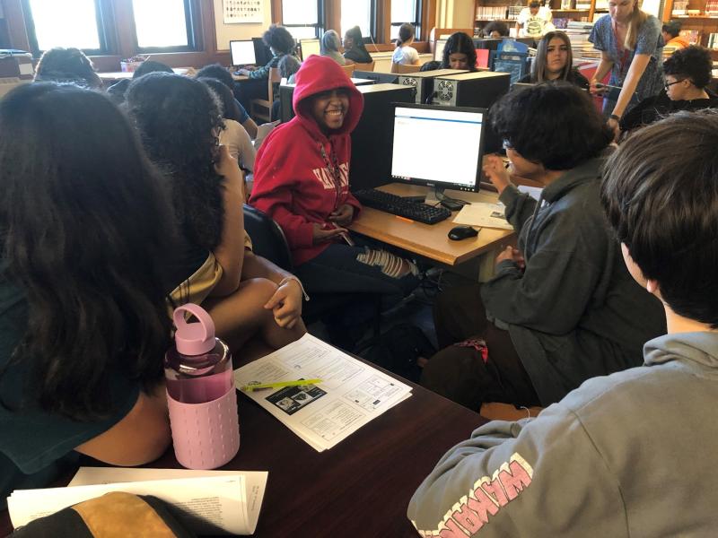 Bay View High School students working together in front of computer